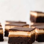 Enjoy this decadent recipe for four layer Snickers Brownies. These will satisfy the most insane sweet tooth!