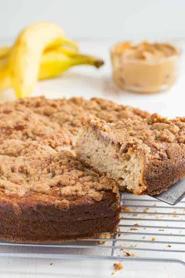 peanut butter banana coffee cake with a slice being taken out