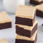 angled view of fudgy brownies with peanut butter frosting