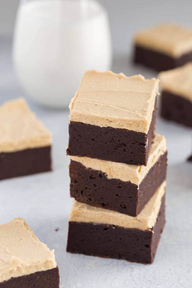 angled view of fudgy brownies with peanut butter frosting