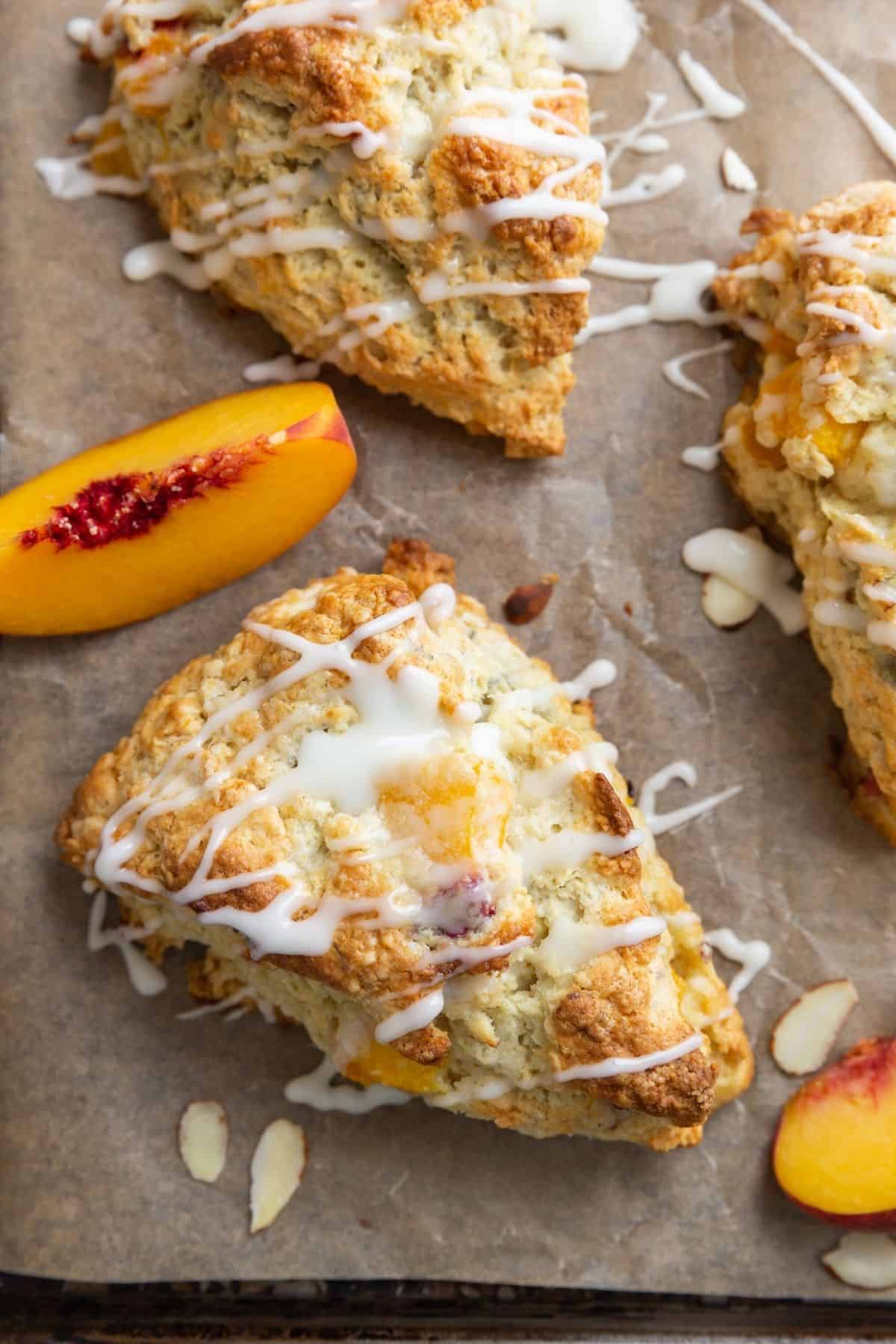 Overhead close up of peach scones on a baking sheet.
