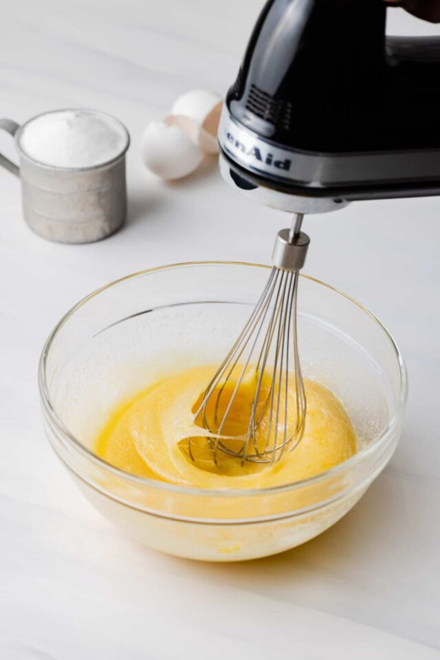 Eggs being beaten with a hand mixer