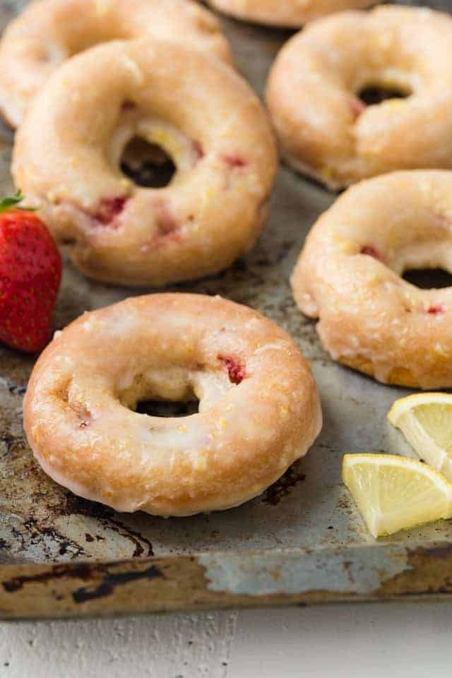 Strawberry Donuts with Lemon Glaze on a baking sheet