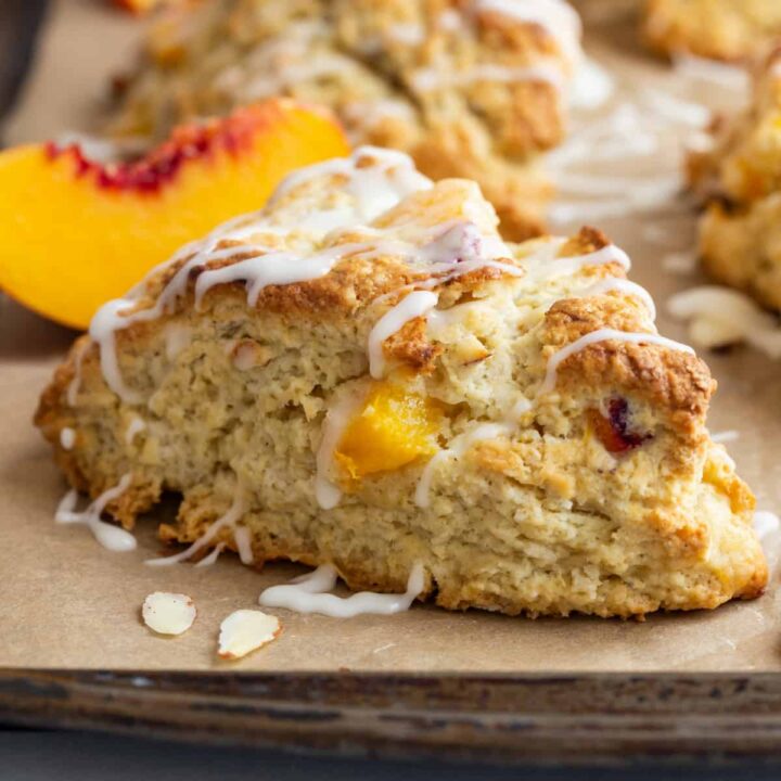 side view of peach scones on a baking sheet