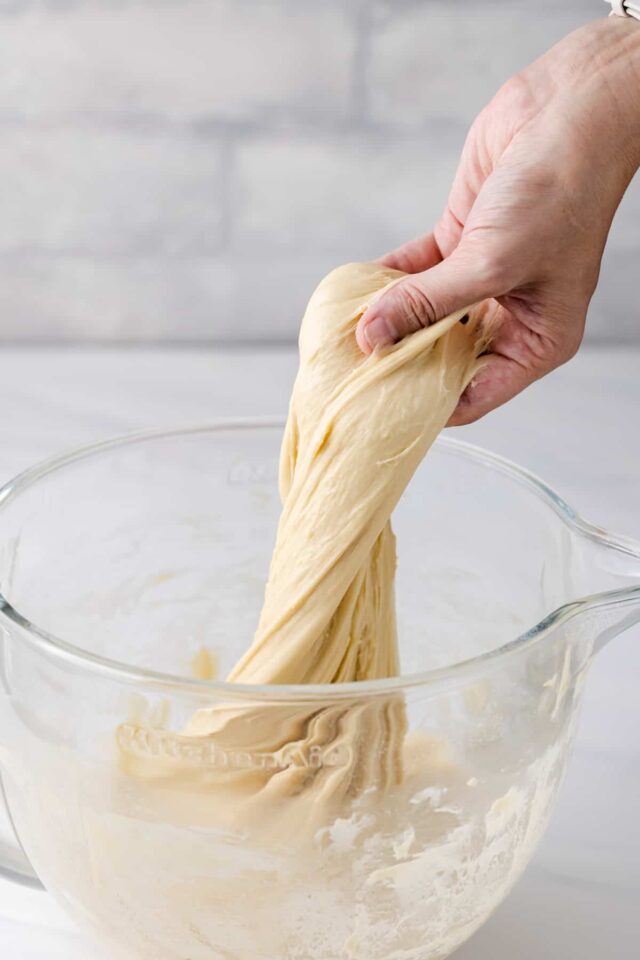 Dough being kneaded in a mixing dish