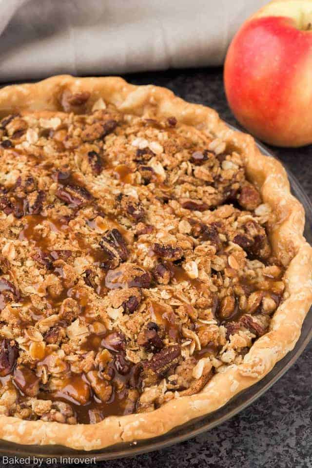 Side view of a caramel apple pecan streusel pie.