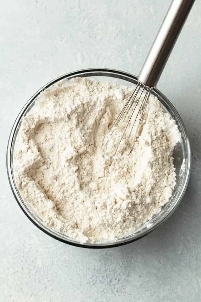 dry ingredients for butterscotch toffee cookies in a glass bowl