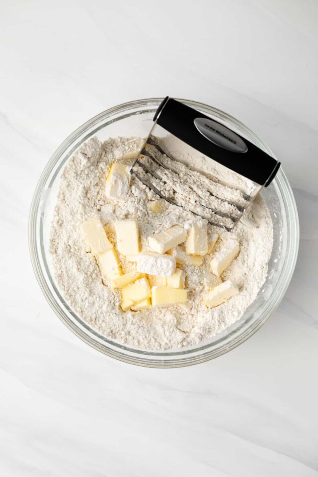 Butter being cut into pastry dough