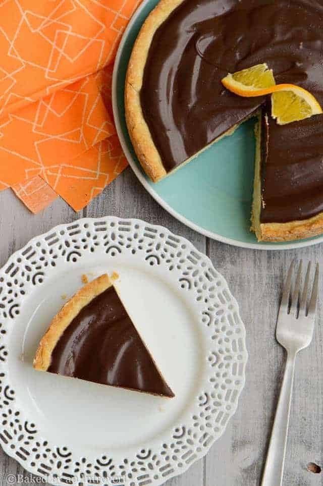 overhead of chocolate orange ricotta tart with a slice taken out