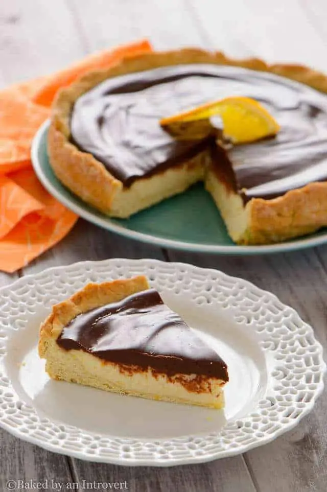 a slice of Chocolate Orange Ricotta Tart on a white plate