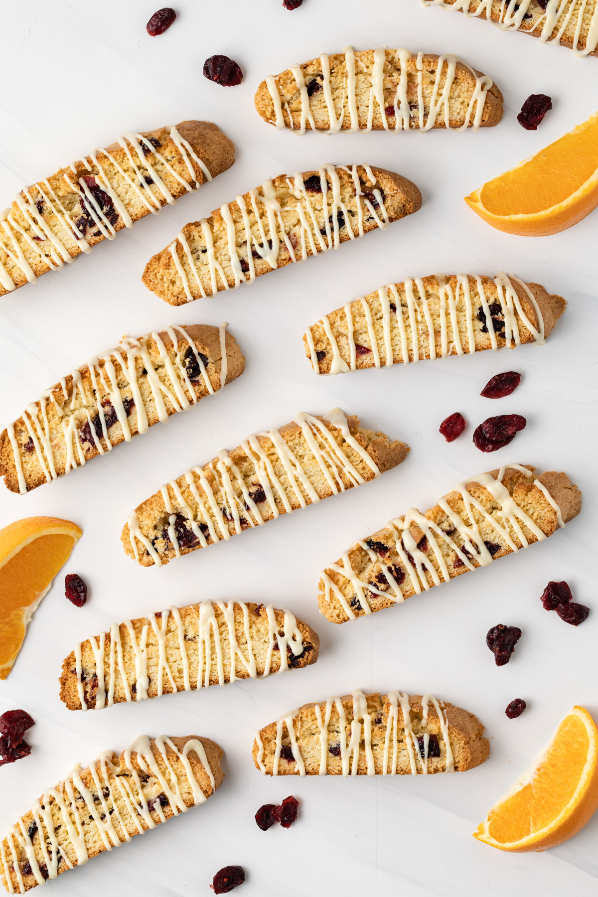 Overhead view of biscotti drizzled with white chocolate