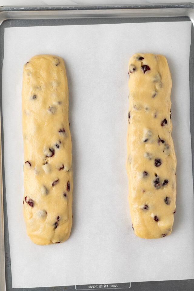 Two logs of unbaked orange cranberry biscotti