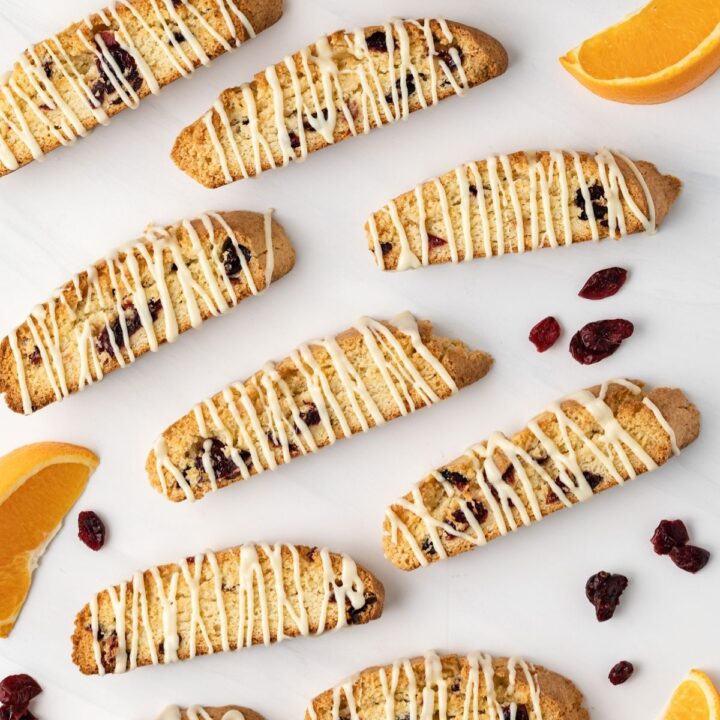 Overhead view of biscotti drizzled with white chocolate