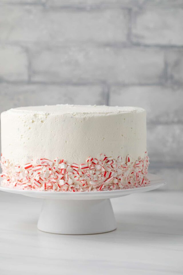A peppermint fudge cake with buttercream frosting on a cake platter
