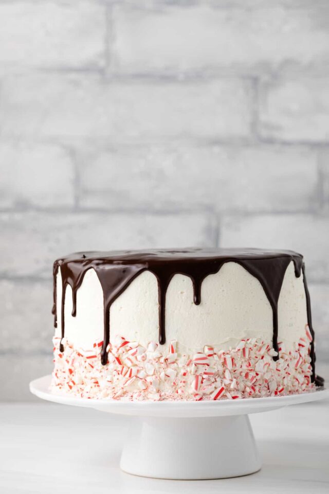 Chocolate ganache spilling over the sides of a layer cake