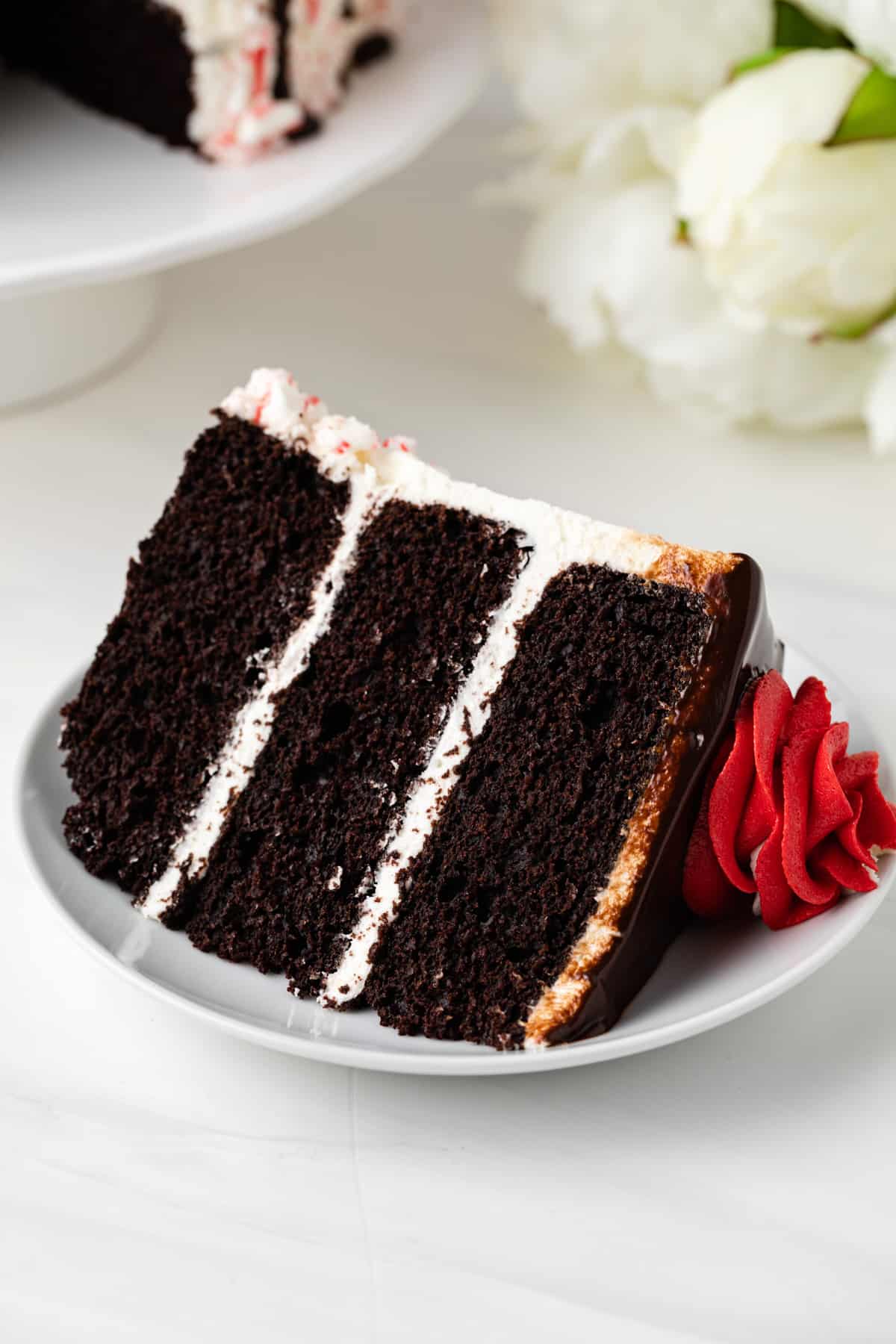 Slice of peppermint fudge cake on a white plate