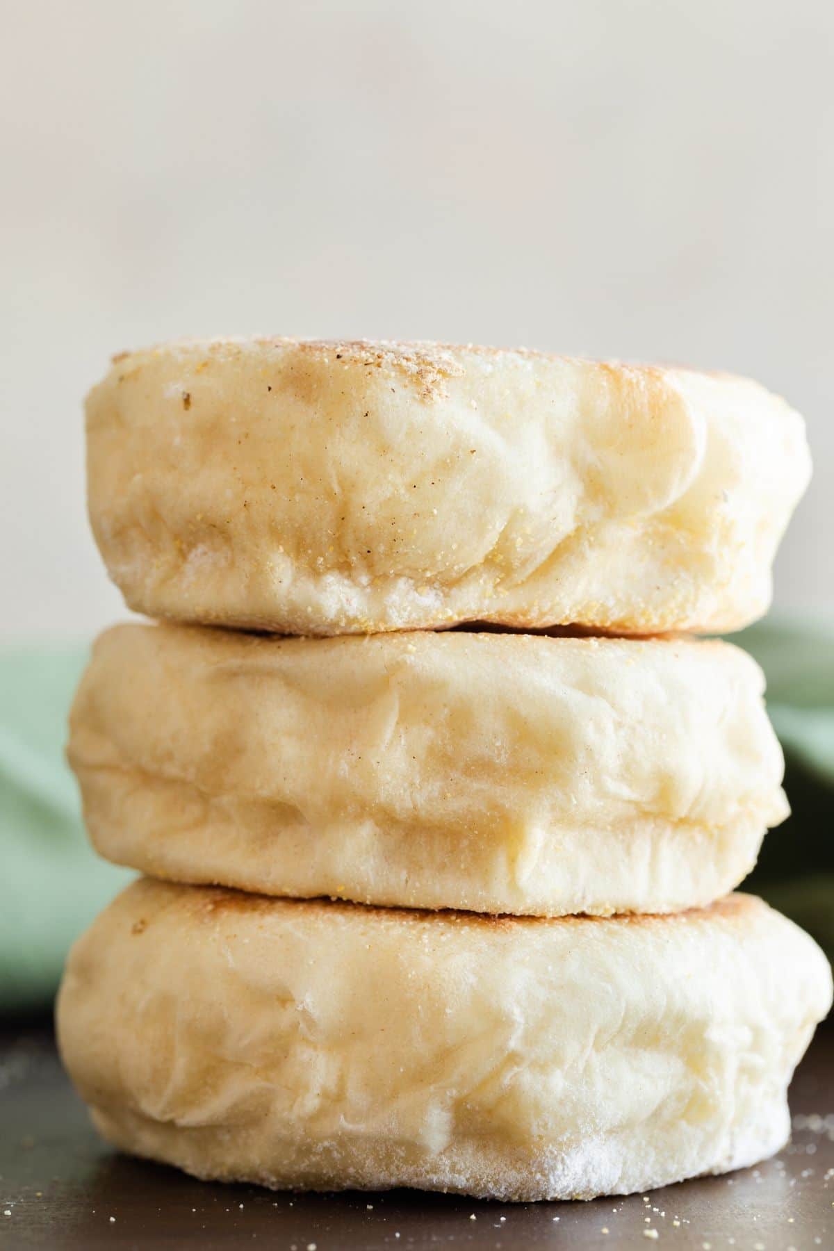 Homemade English muffins stacked three high