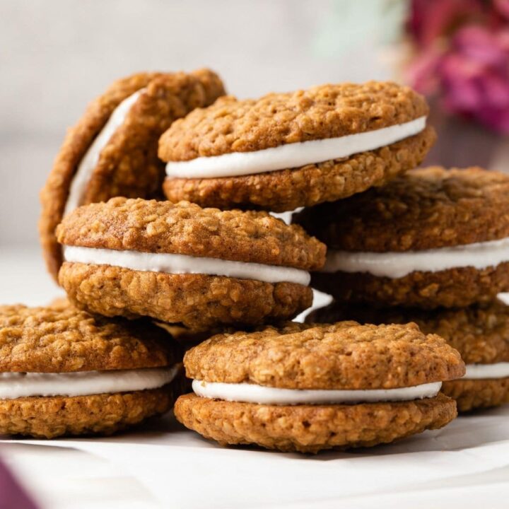 Oatmeal cream pies stacked on a tabletop.