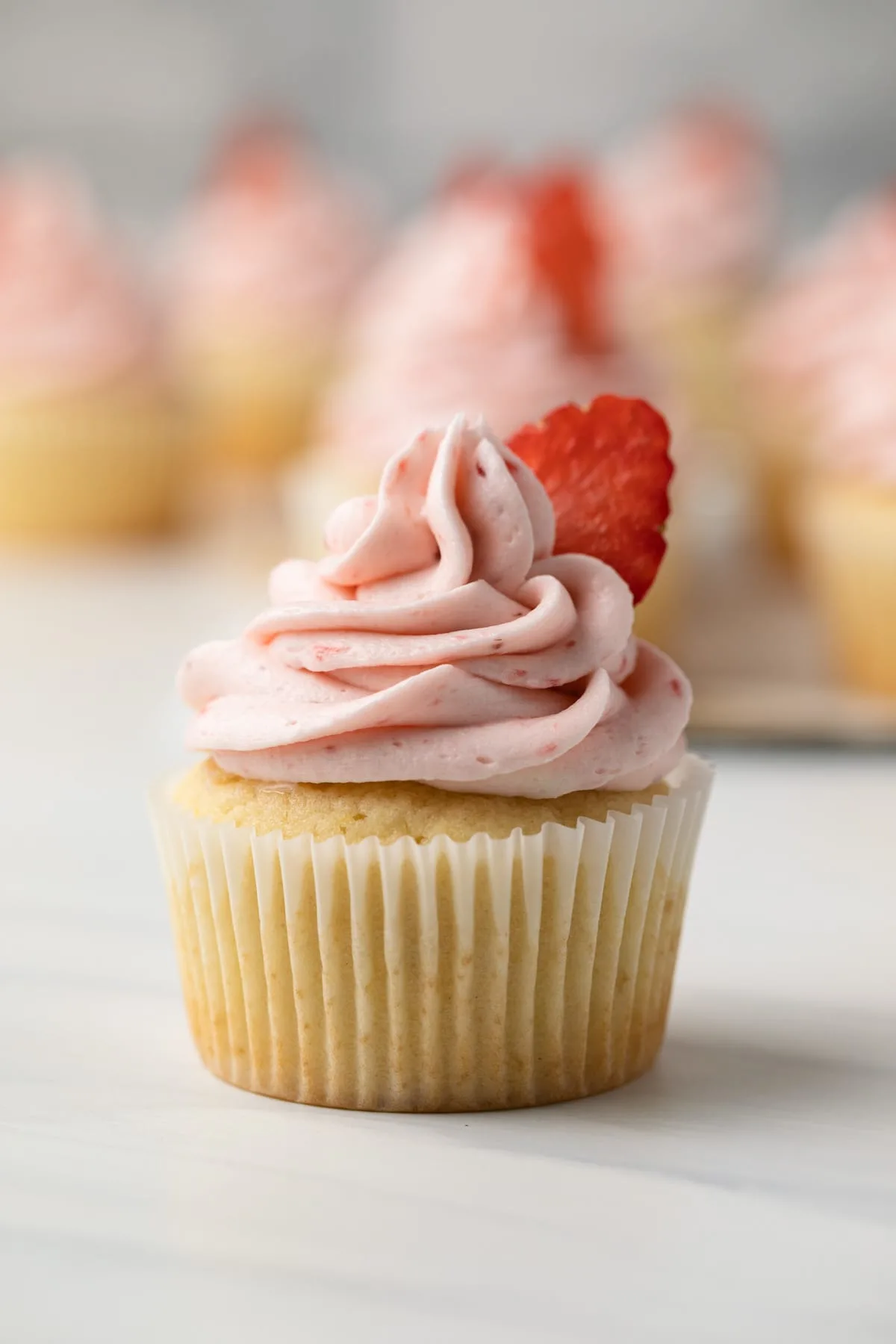 Vanilla yogurt cupcakes with strawberry frosting.