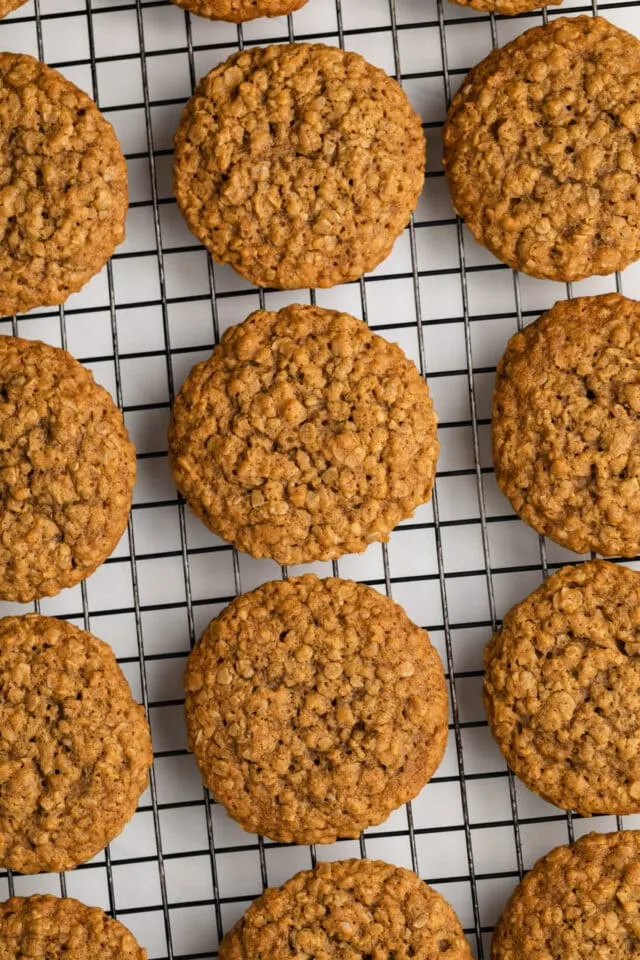 Oatmeal cookies on wire rack.