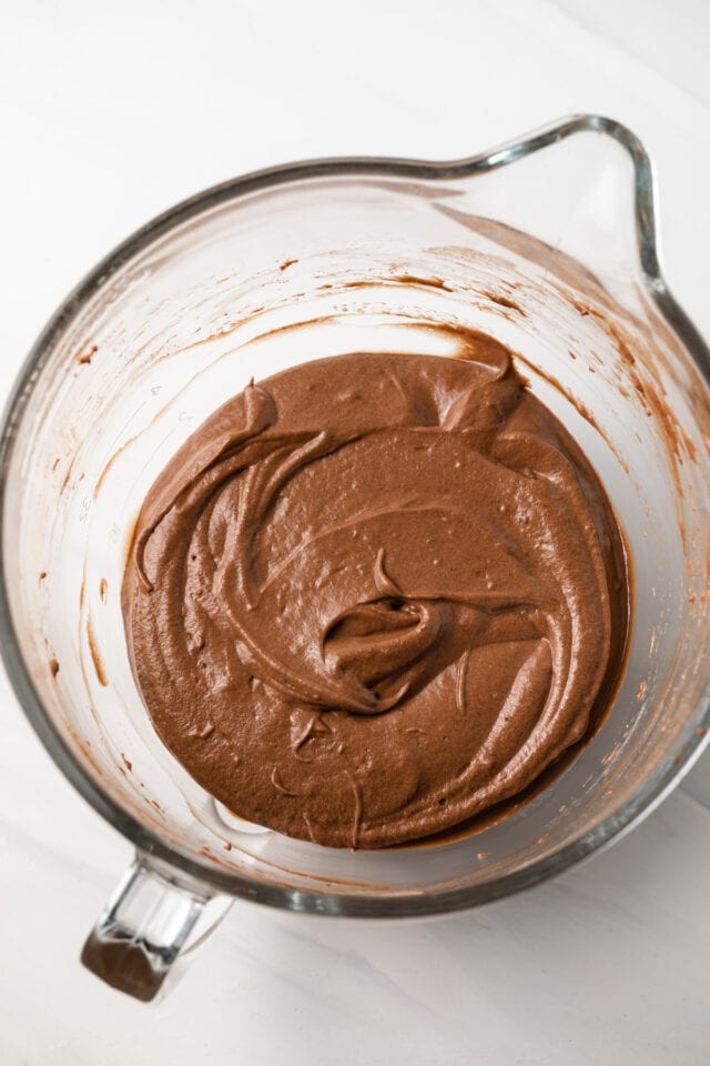Chocolate cupcake batter in glass bowl.