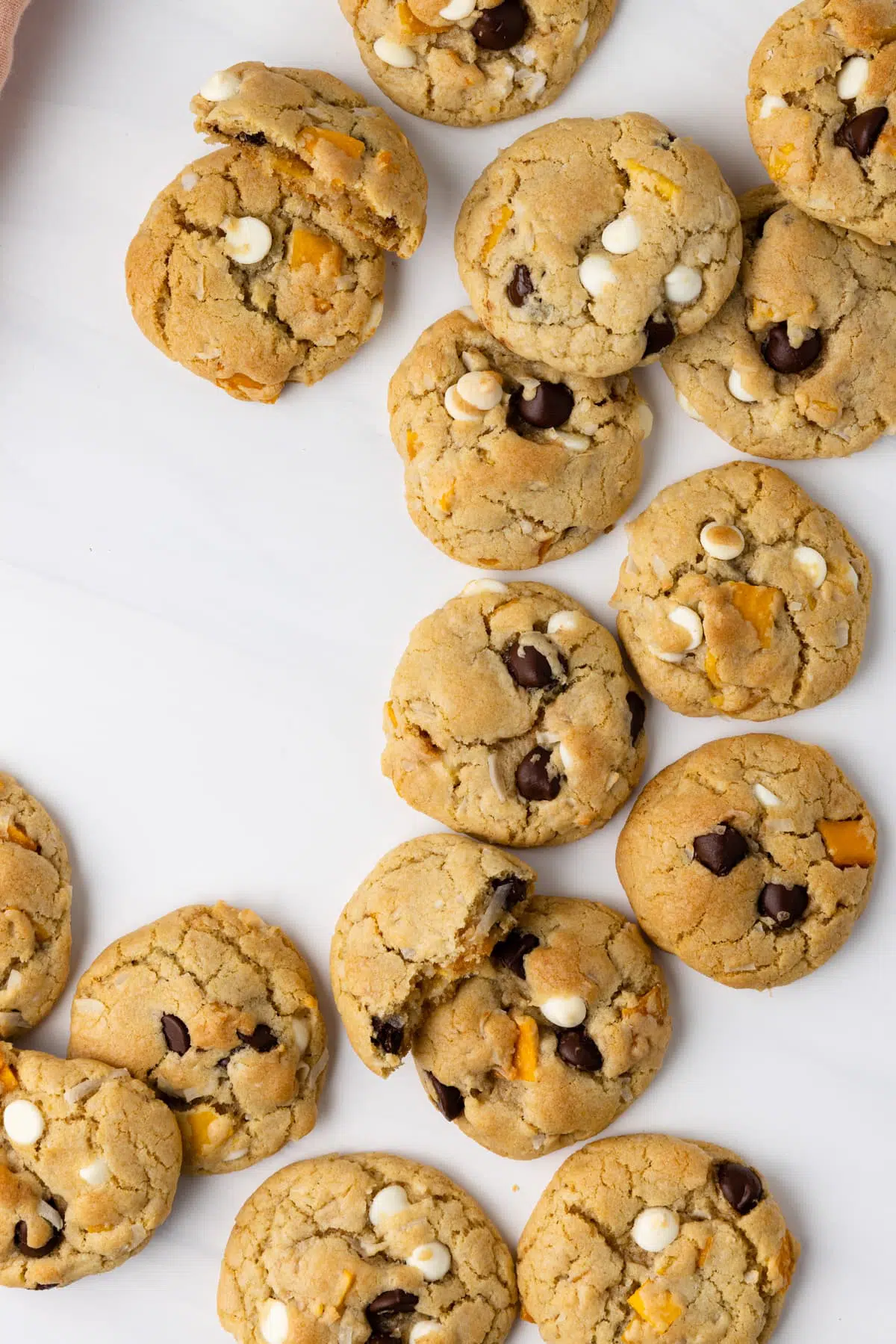 Coconut mango chocolate chip cookies on a white background.