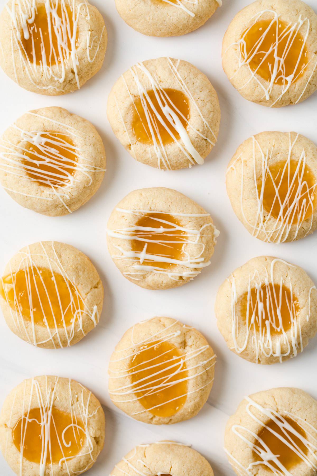 overhead of lemon thumbprint cookies on white background