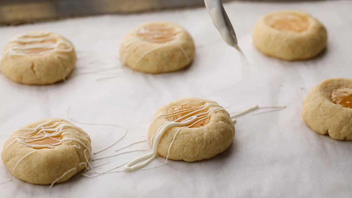 white chocolate drizzled over lemon curd cookies