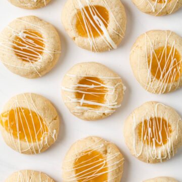 overhead of lemon thumbprint cookies on white background