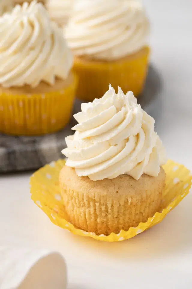 Pineapple cupcake with the paper liner pulled away.