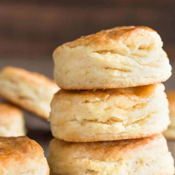 A stack of three honey cream cheese biscuits.