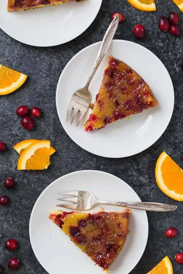 2 slices of Cranberry Orange Upside Down Cake on plates.