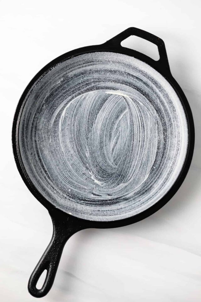 A cast iron skillet greased with butter