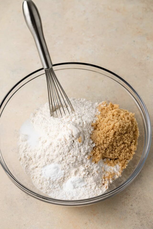 Flour and brown sugar in a white bowl