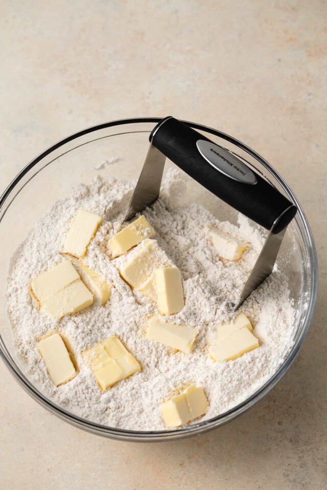 Butter being cut into a flour mixture