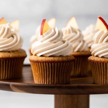 Apple spice cupcakes garnished with an apple slice