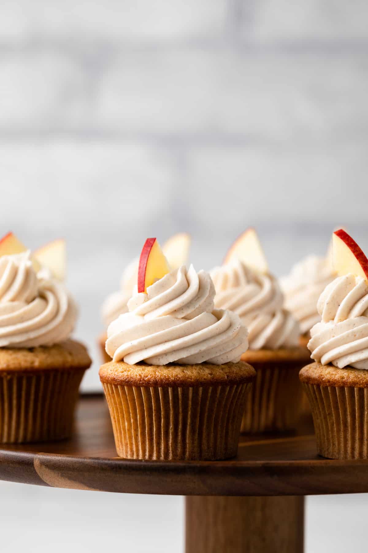 Apple spice cupcakes garnished with an apple slice