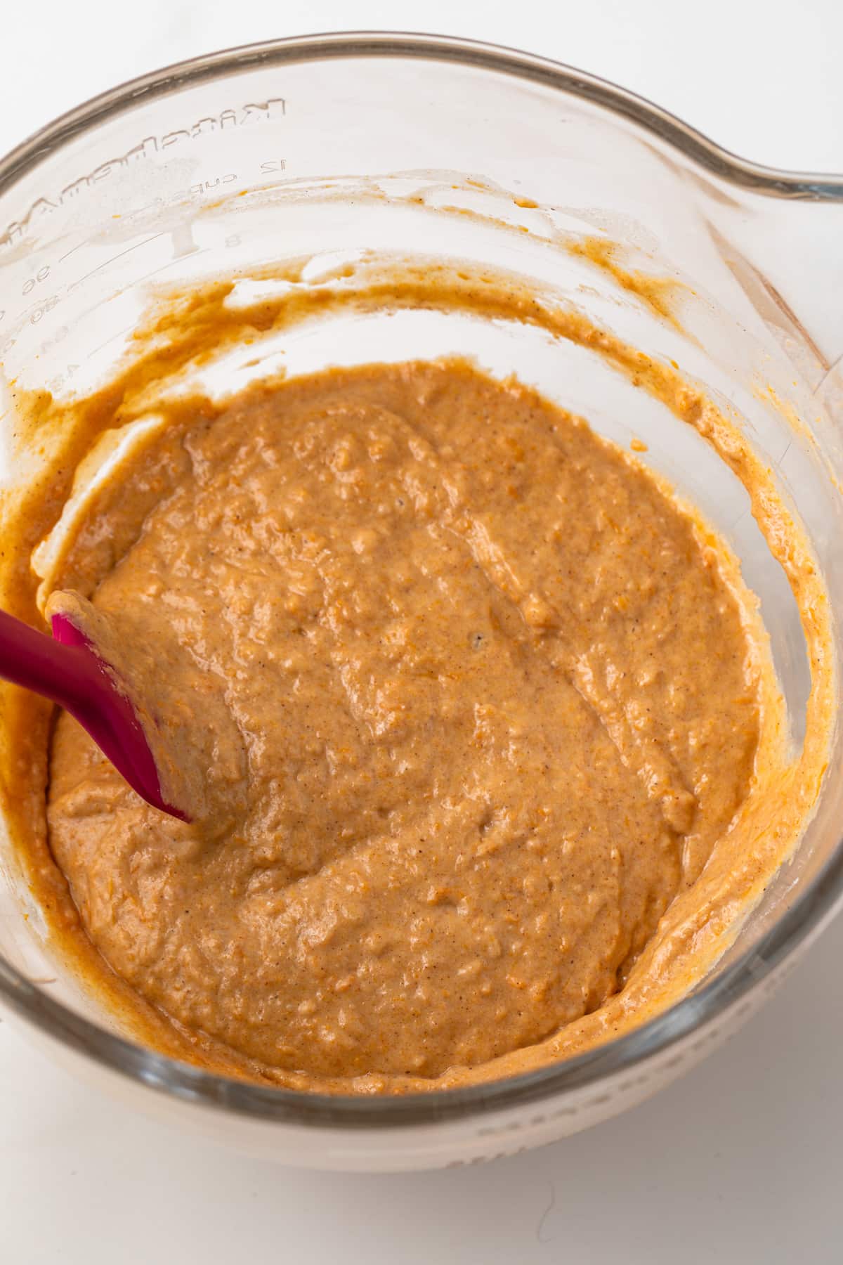 Cake batter in a glass bowl.