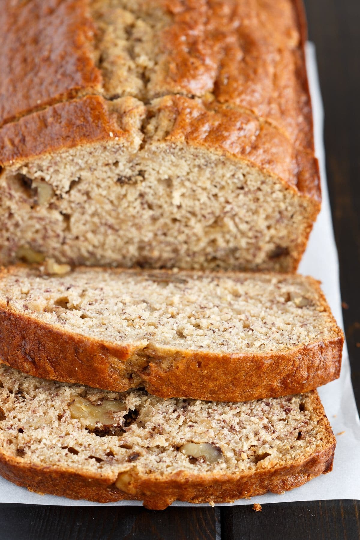 Sliced banana bread with slices taken out.