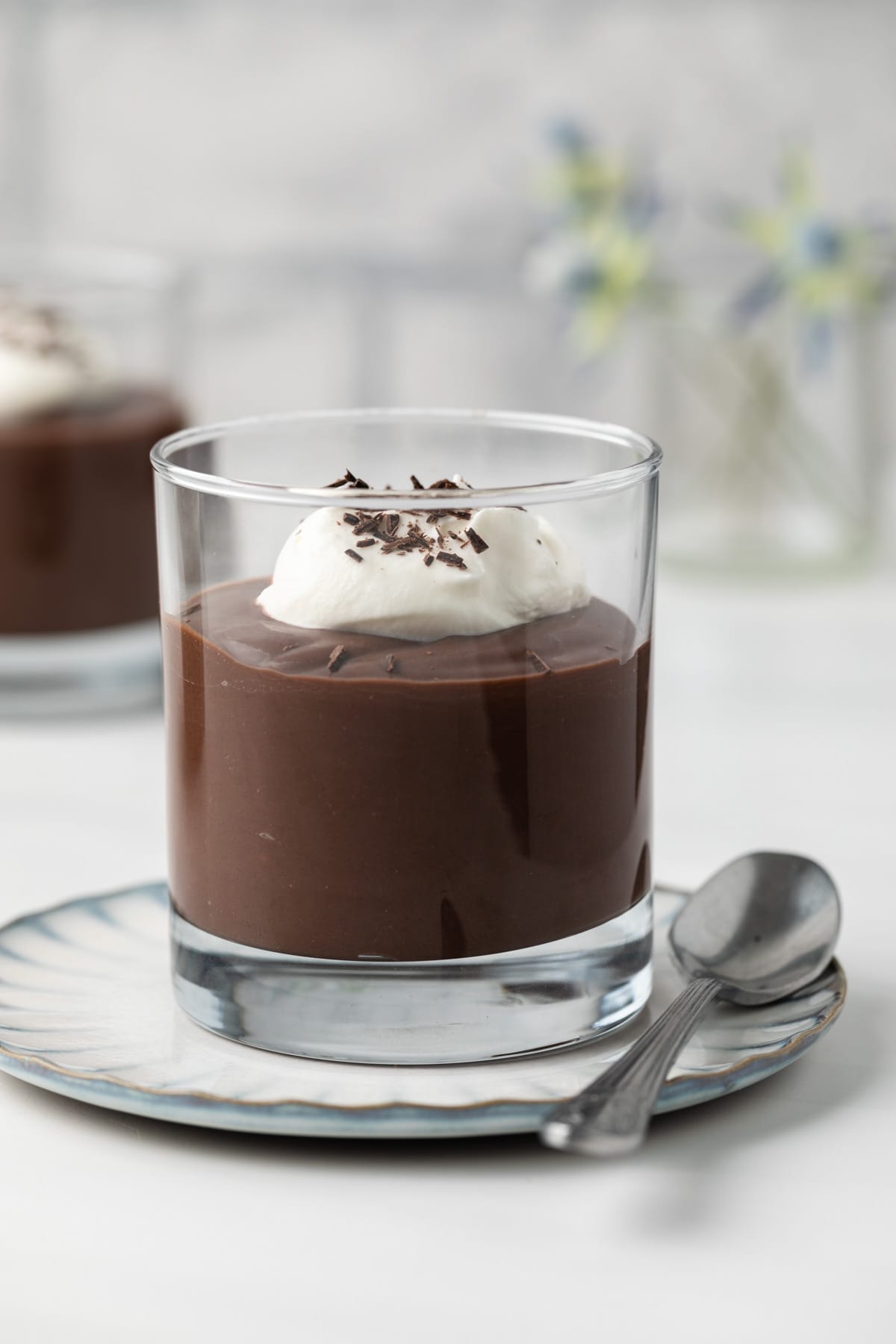 Chocolate pudding topped with whipped cream.