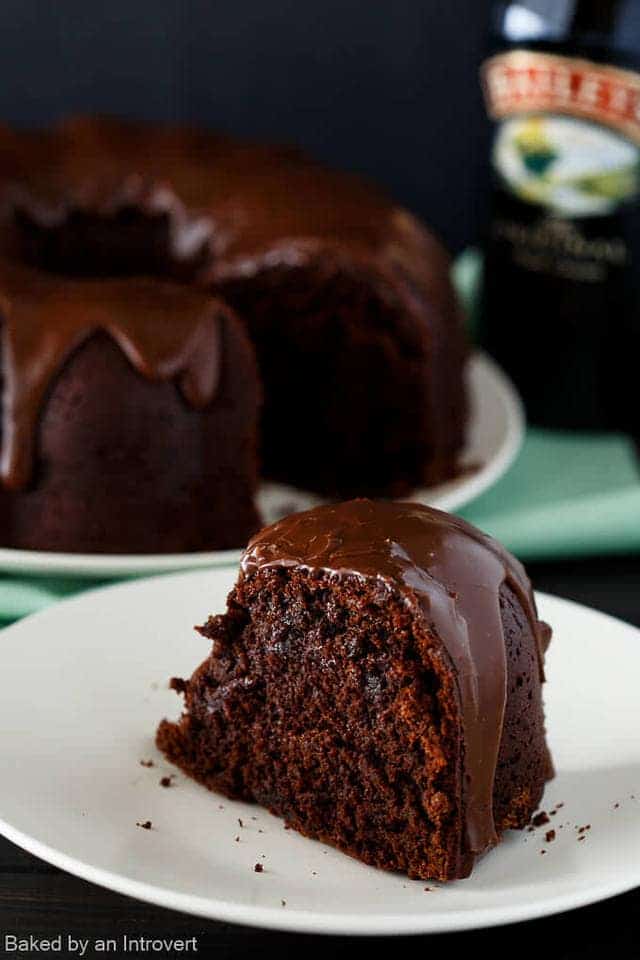 Slice of Irish chocolate coffee bundt cake on a cream plate.