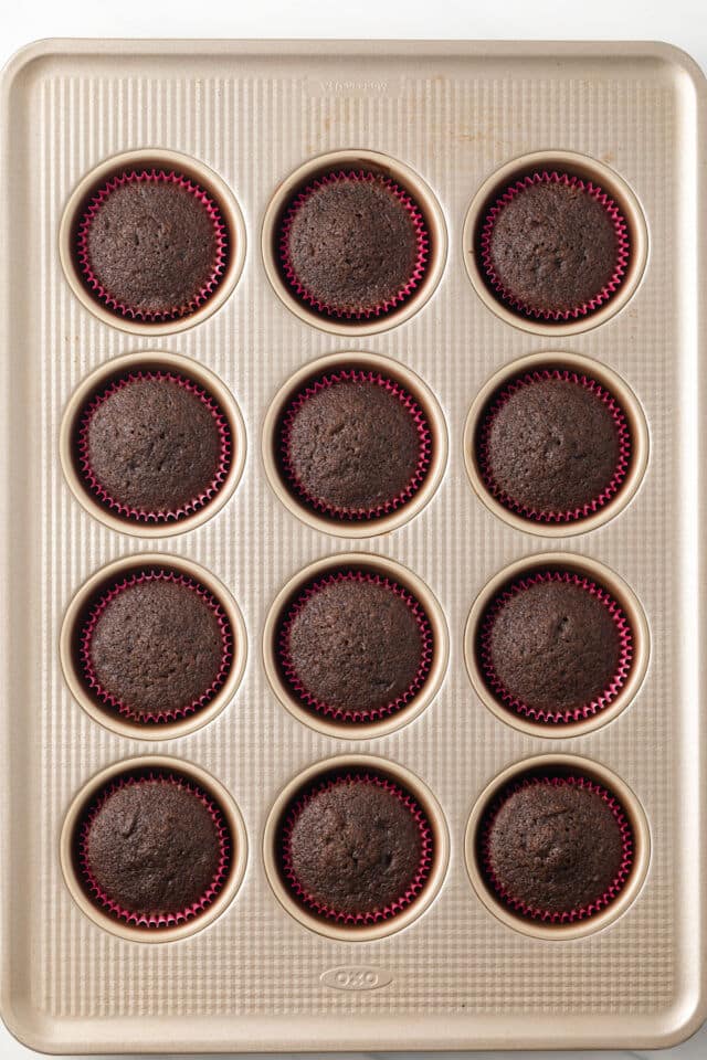 Chocolate cupcakes in muffin pan.