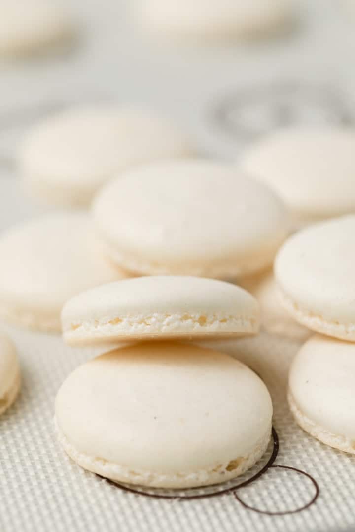 macaron shells on a baking sheet