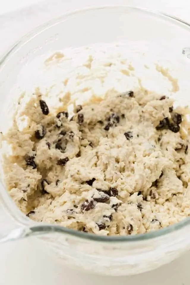 Irish soda bread dough in a glass mixing bowl.