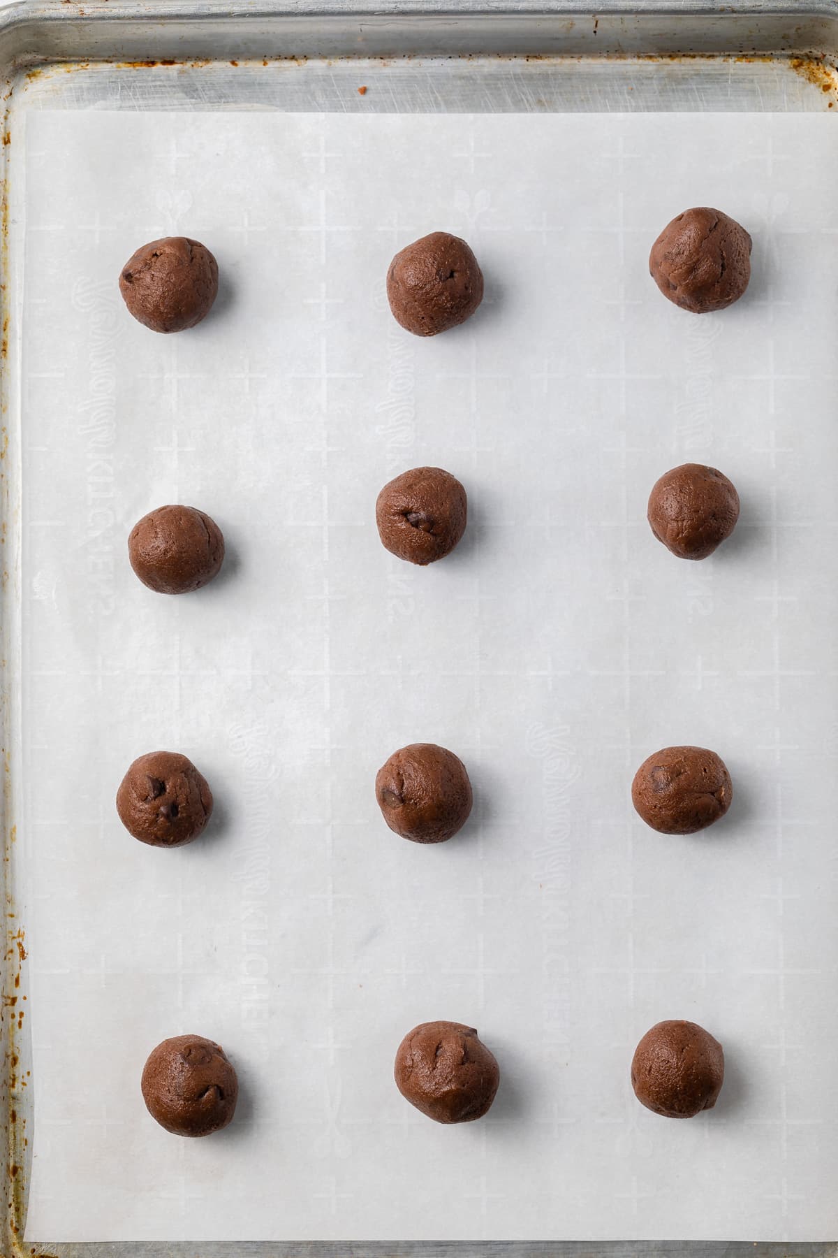 Nutella cookie dough balls on a baking sheet.