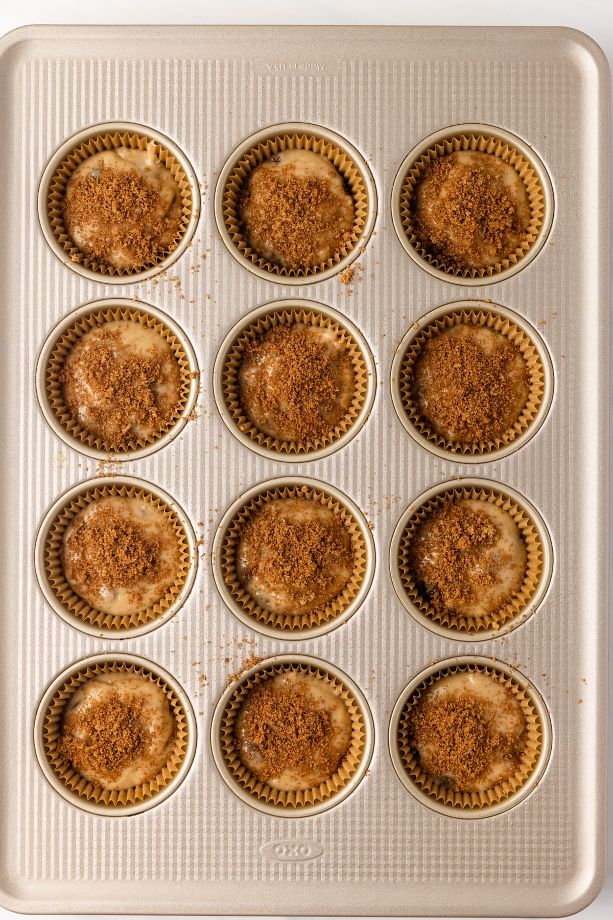 Unbaked muffin batter in muffin pan.