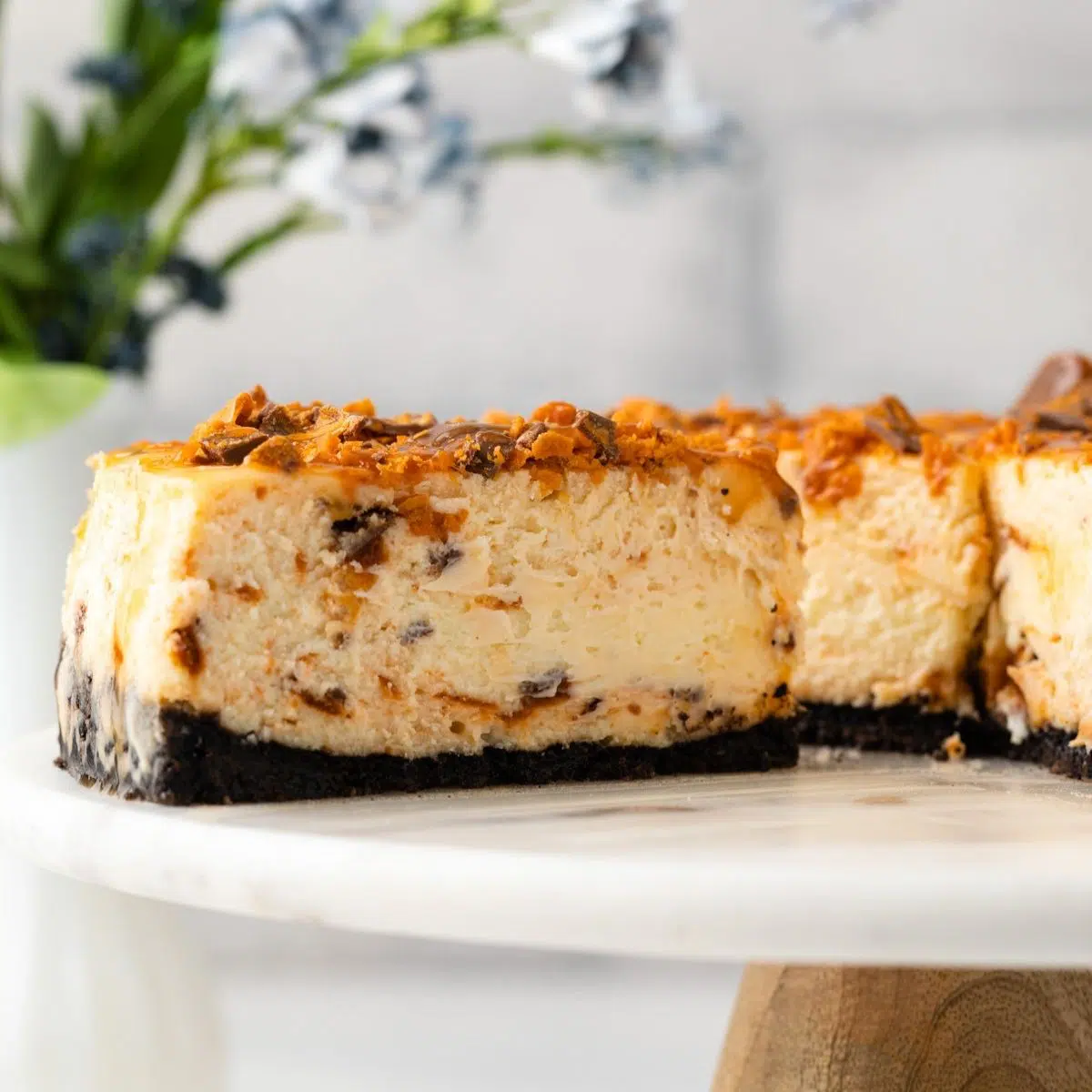 Butterfinger Cheesecake with Caramel Drizzle