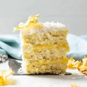 slice of pineapple coconut cake on a serving spatula