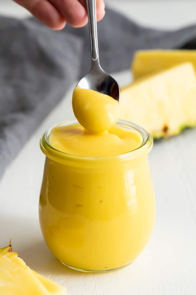 Pineapple curd on a spoon