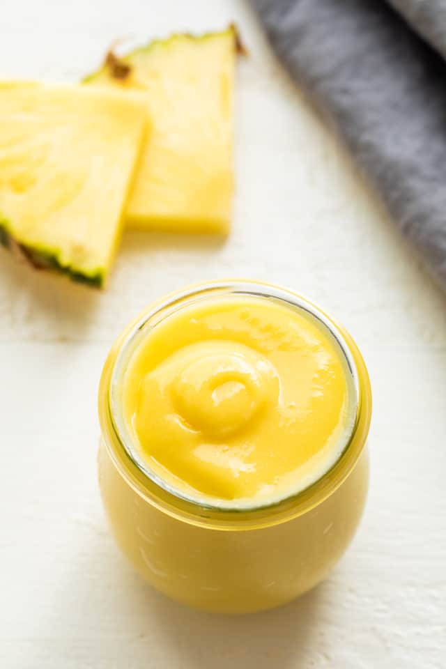 Overhead view of pineapple curd in a jar